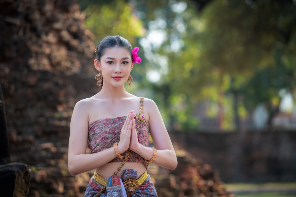 portrait-asian-model-posing-to-pay-respect-with-sm-2023-11-27-05-14-31-utc